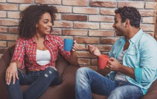 man and woman having coffee and talking about their relationship