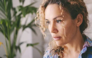 close up of a woman staring and looking anxious