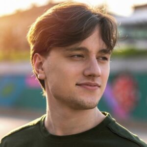 Smiling young man looking off to the side