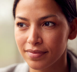 Close up shot of a multiculture woman looking hopeful