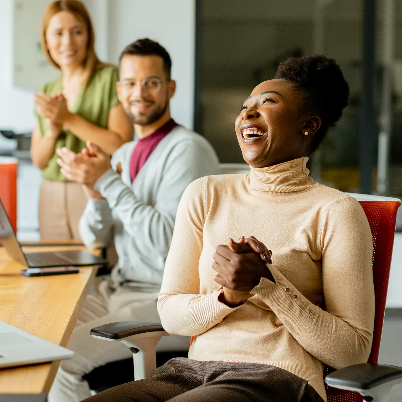 joyful business woman supported by her employers