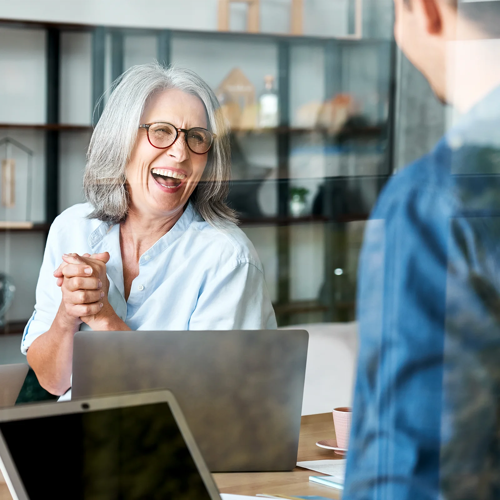 happy female supervisor coaching employee